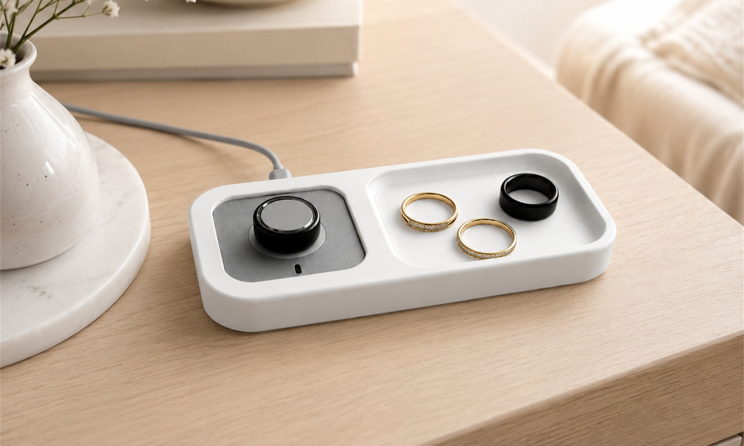 Bandsmith Oura Ring charger holder on a bedside table with rings stored beside the charger