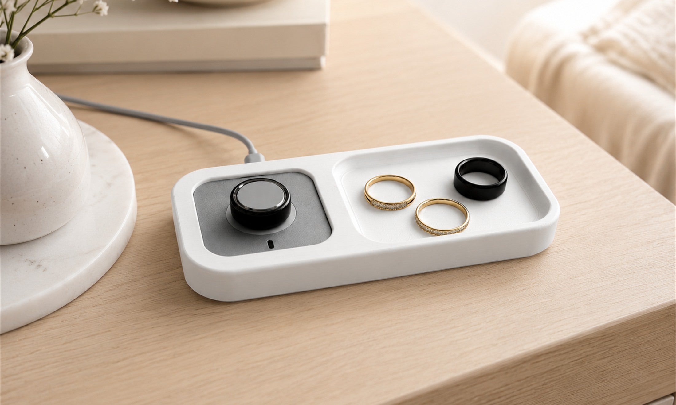 Bandsmith Oura Ring charger holder on a bedside table