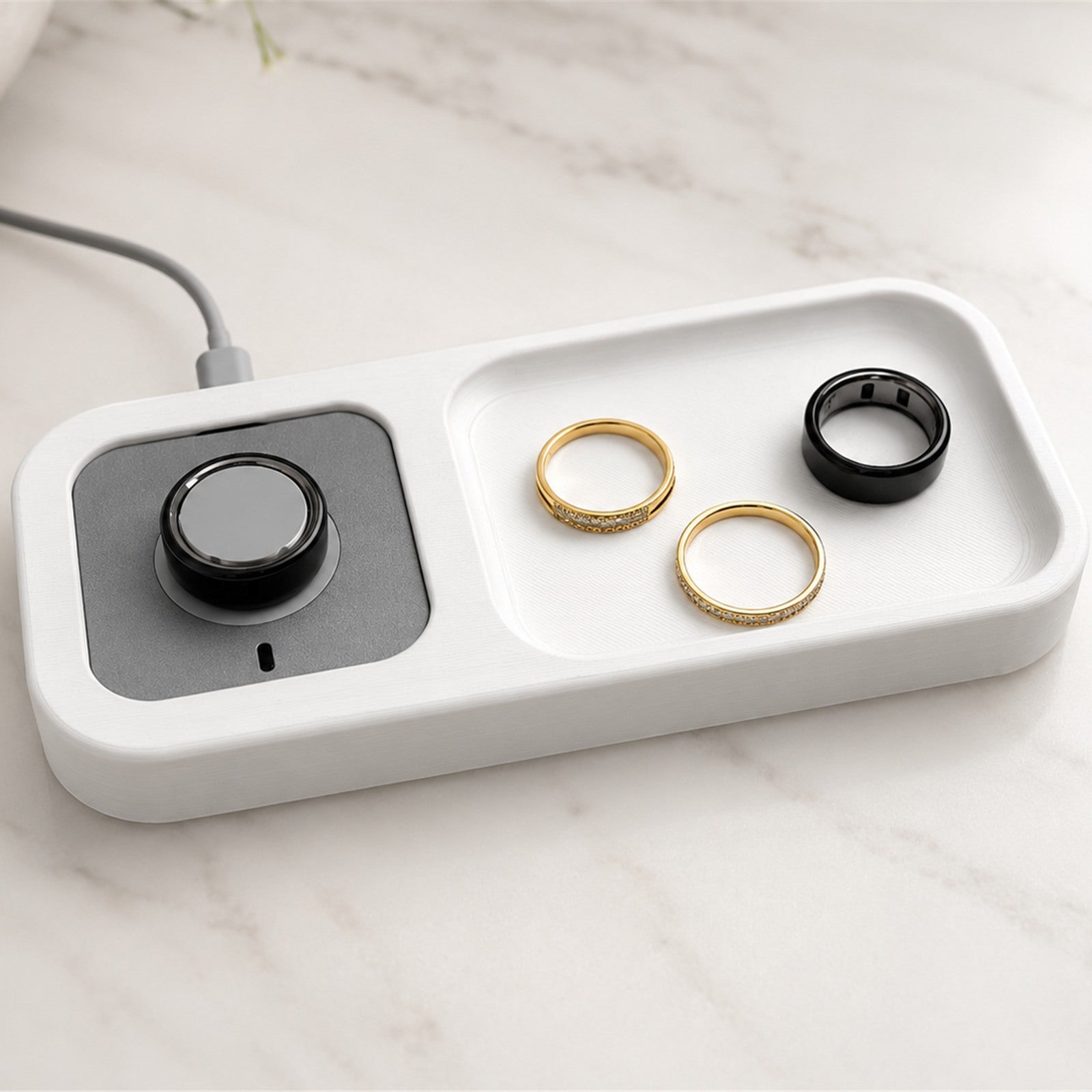 Official Oura Ring charger sitting inside the Bandsmith holder
